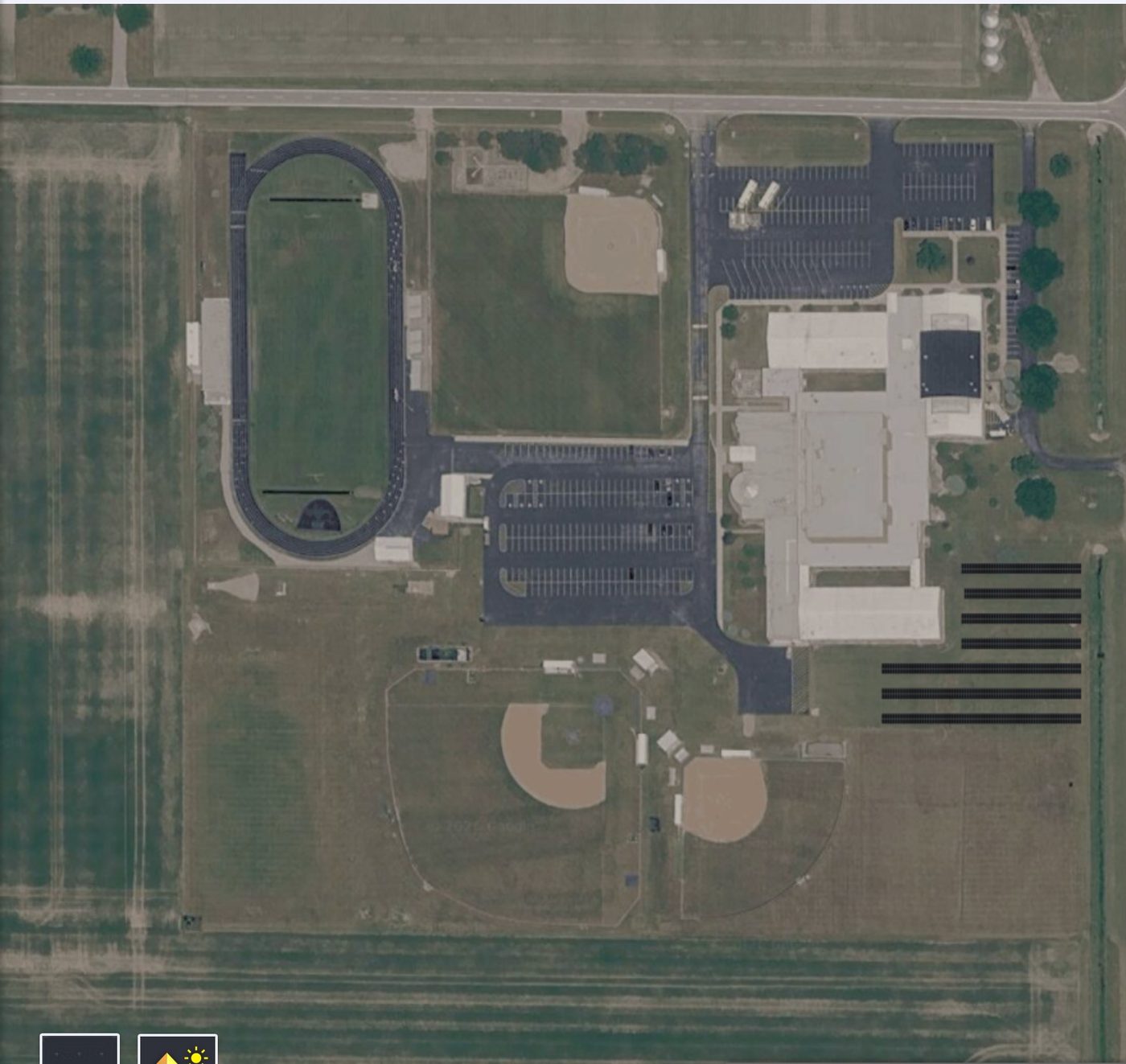 Aerial view of Wayne Trace High School campus showing proposed ground-mount solar array southeast of the building near the track